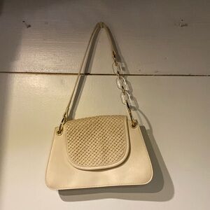 White purse with gold and clear handle decor